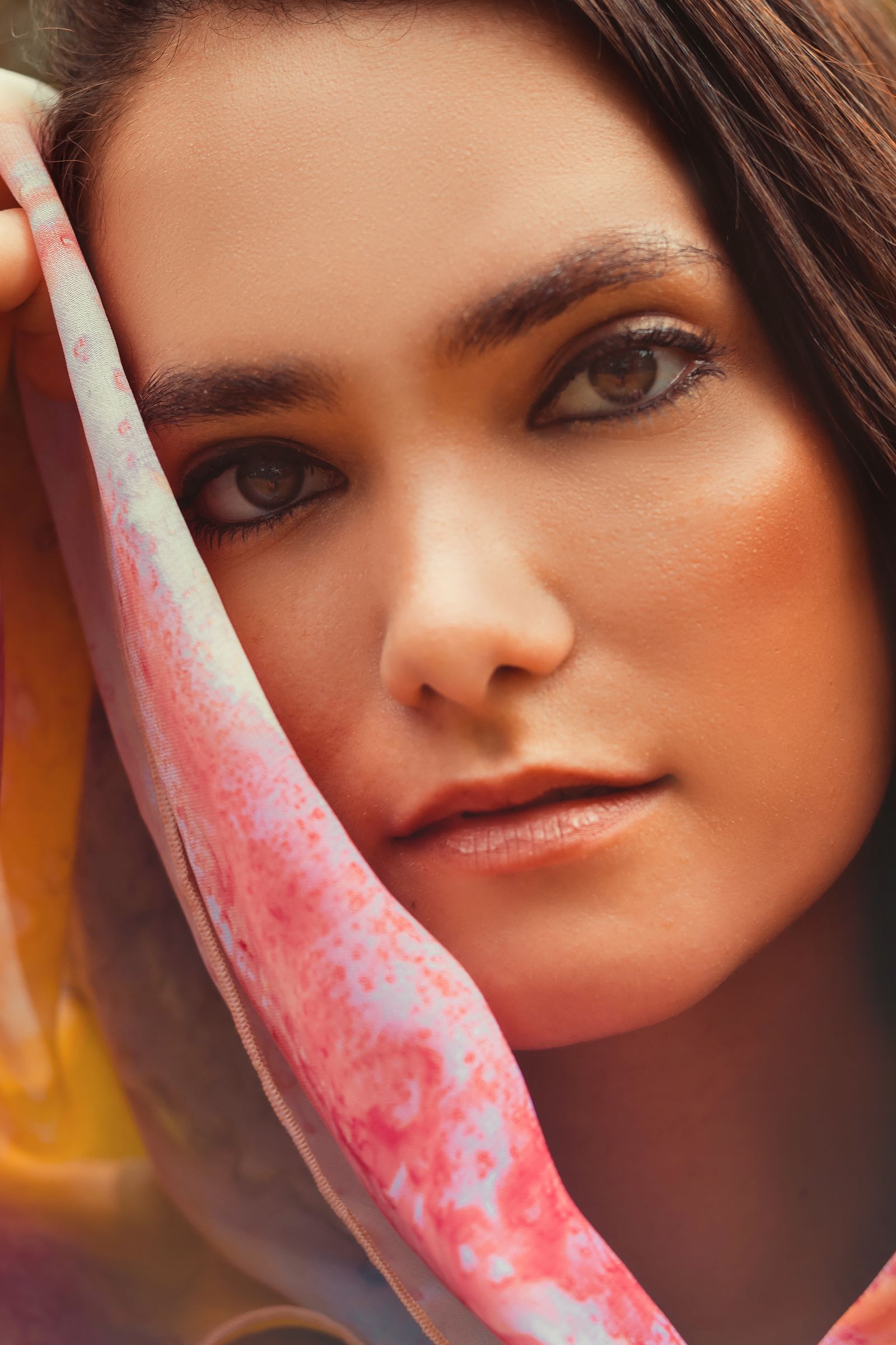 Neutral woven wrap draped in a relaxed editorial portrait