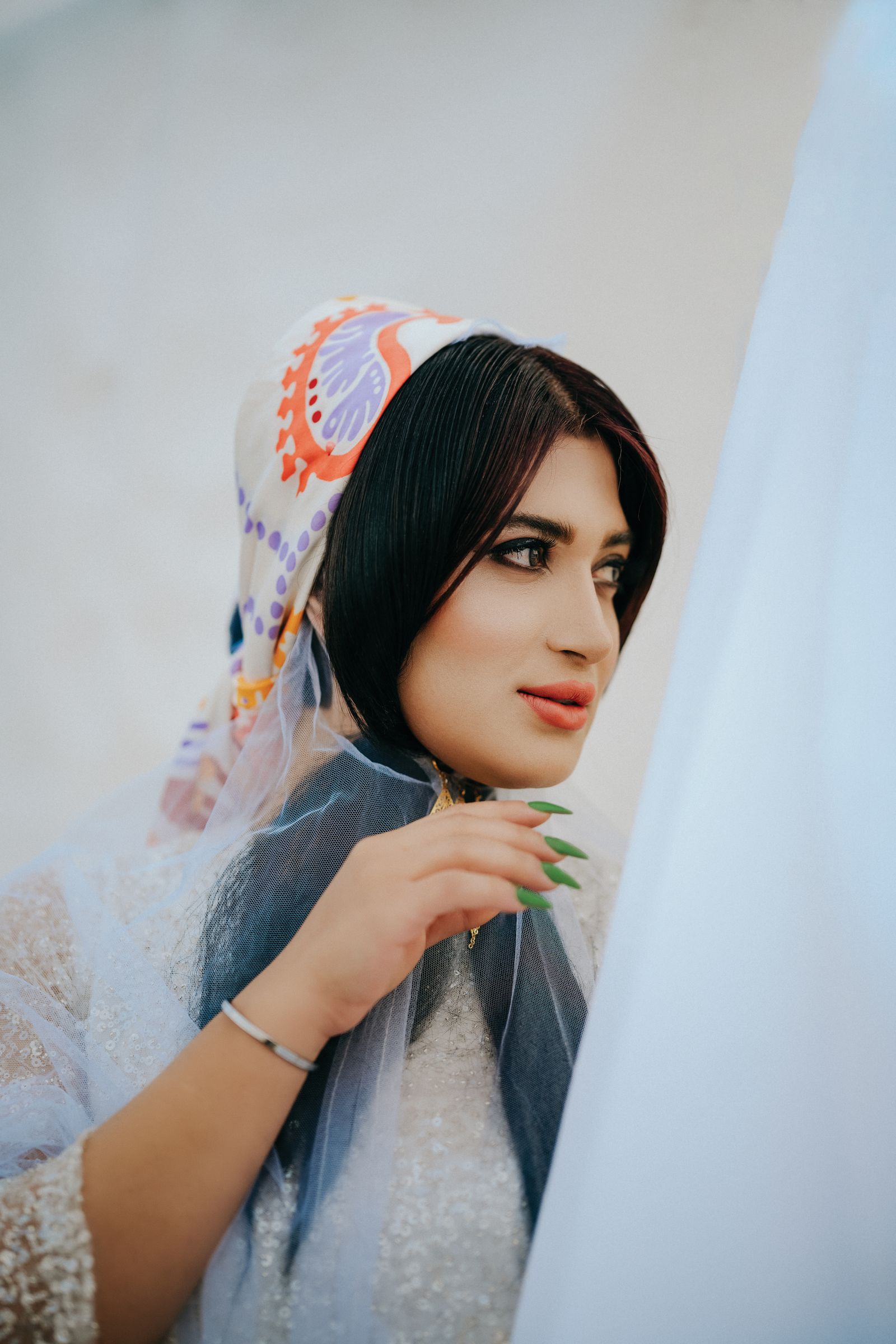 Dark embroidered shawl styled as an elegant evening wrap